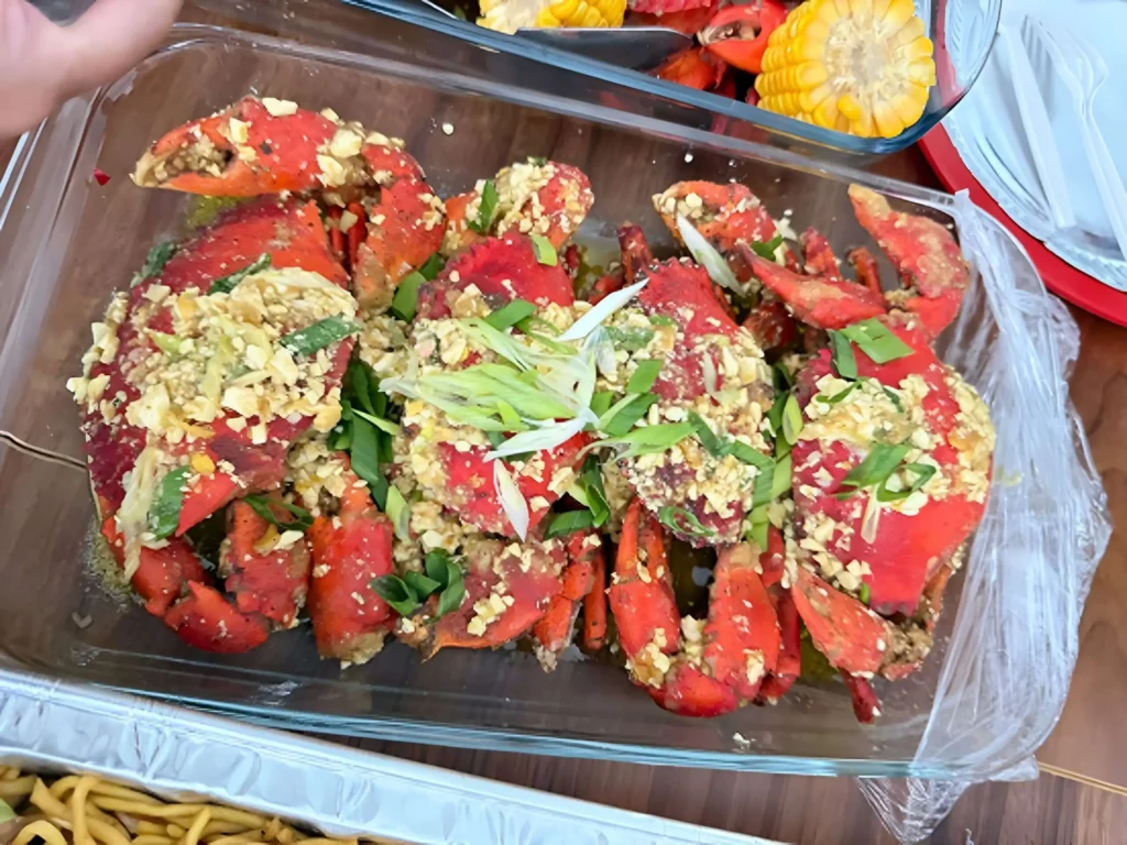 Freshly cooked salted egg crab with thick golden sauce and red chili garnish