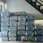 Stack of BigByte Aquaventures vertical crab farming boxes neatly stored inside the facility.